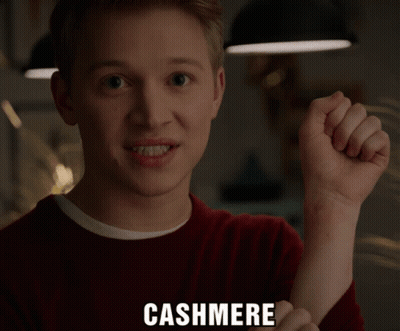 Man In Denim Shirt Next To Netflix Sign GIF