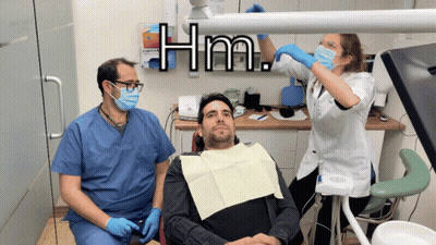 Man In Dental Chair With Two Dentists Hm GIF