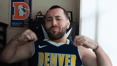 Man In Denver Jersey Flexing Muscles In Front Of Broncos Poster GIF