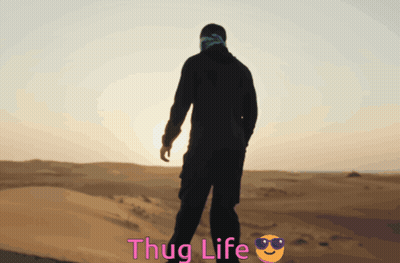 Man in Desert With Thug Life Behind Him