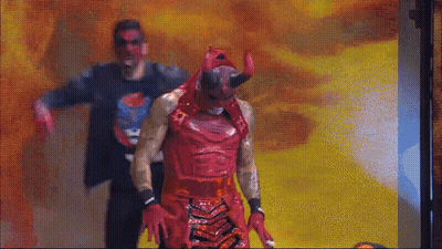 Man In Devil Costume Next To Man In Black Shirt GIF