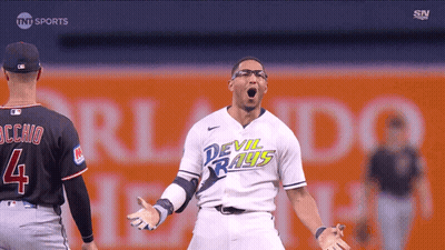 Man In Devil Rays Jersey Stands On Field GIF