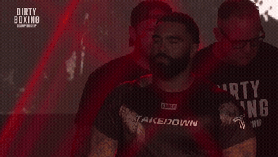 Man In Dirty Boxing Shirt Walking Down Stairs GIF