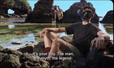 Man In Diving Mask On Rock By Water GIF