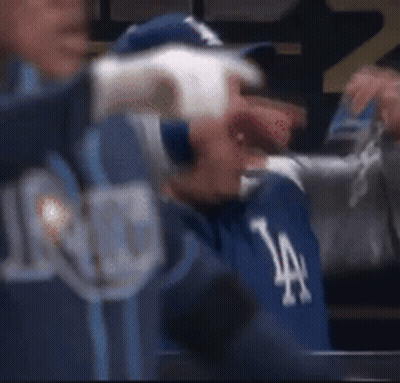 Man In Dodgers Hat Sitting In Dugout GIF