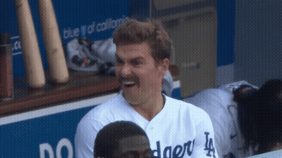 Man In Dodgers Jersey Laughs In Dugout GIF