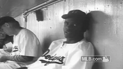 Man In Dodgers Jersey Leaning In Black And White GIF
