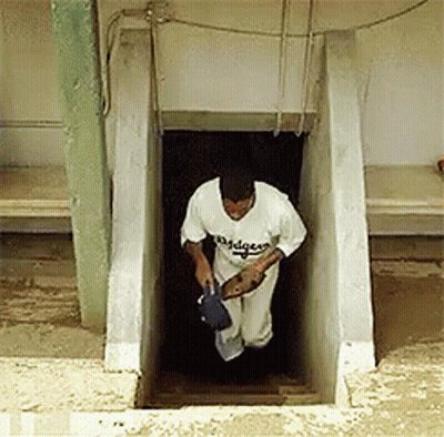 Man In Dodgers Jersey Walking Out Staircase GIF