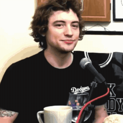 Man In Dodgers T-Shirt At Microphone GIF