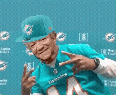 Man In Dolphins Jersey And Hat GIF