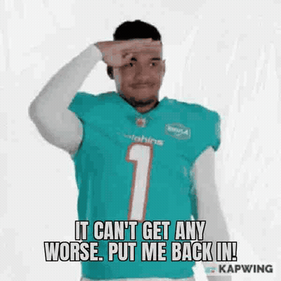 Man In Dolphins Jersey Holding Hand To Forehead Making Funny Face GIF