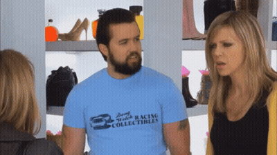Man In Dong Welch Racing T-Shirt Talking To Two Women GIF