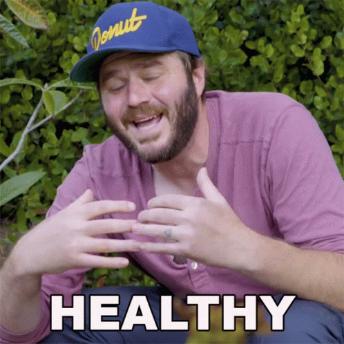 Man In Donut Hat And Purple Shirt Saying Healthy GIF