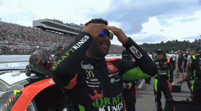 Man In Draft Kings Shirt Adjusting Sunglasses GIF