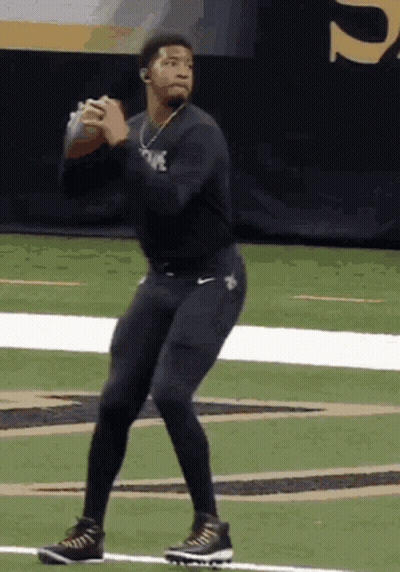 Man In Duke Jersey Throwing Football GIF