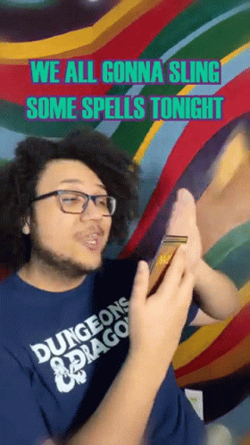 Man In Dungeons And Dragons Shirt Holding Phone GIF