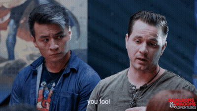 Man In Dungeons And Dragons T-Shirt Talking To Another Man GIF