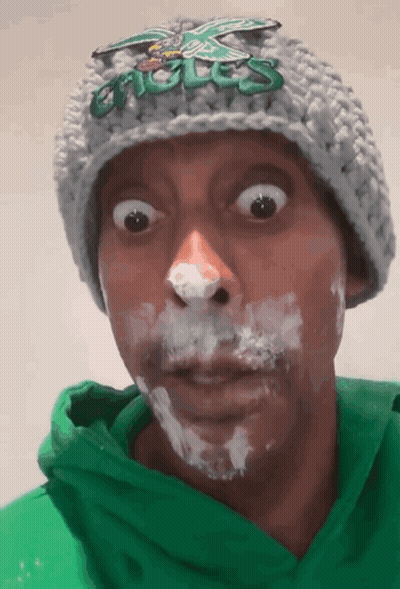 Man In Eagles Hat Green Hoodie Whipped Cream GIF