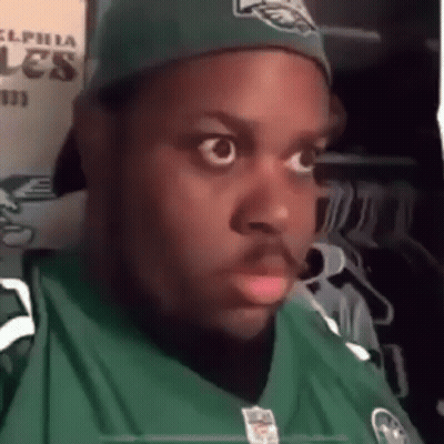 Man In Eagles Jersey And Hat Making Funny Face GIF