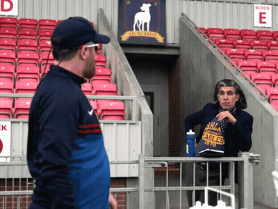 Man In Eagles Shirt Talking In Stadium GIF