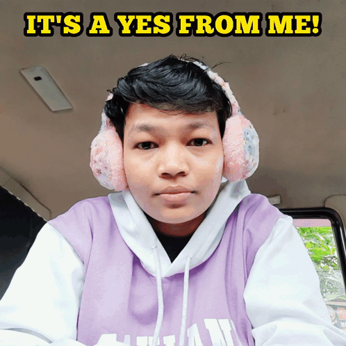 Man In Ear Muffs And Purple Hoodie Saying Yes GIF