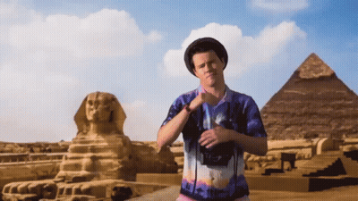 Man In Egypt Shirt In Front Of Pyramid GIF