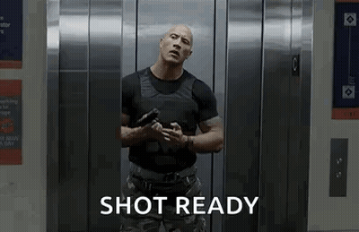 Man In Elevator Holding Gun Saying Shot Ready GIF