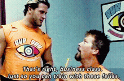 Man In Eye Sow Shirt Talking To Another Man GIF