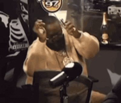 Man In Face Mask At Microphone GIF