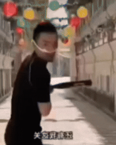 Man In Face Mask Holding Bat In Hallway GIF