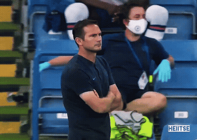Man In Face Mask Sitting In Stadium With Sign Saying Heiitse GIF