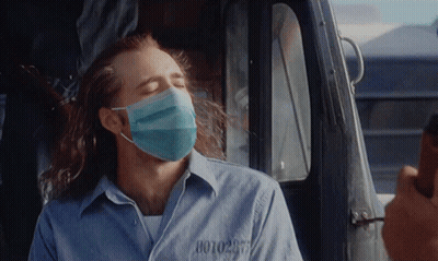 Man in Face Mask With Prison Number 0010297