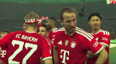 Man In FC Bayern Jersey Hugging Another Man GIF