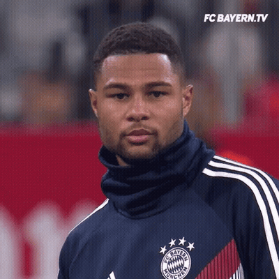 Man In FC Bayern Jersey On Red Field GIF