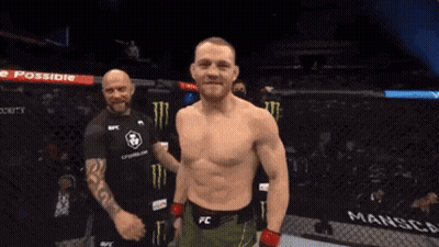 Man In FC Belt Standing In Front Of Man In Black Shirt GIF