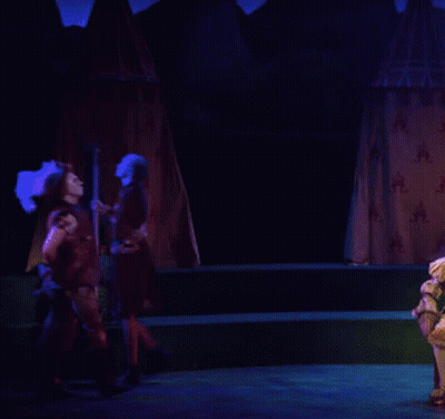 Man In Feathered Hat On Stage GIF