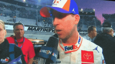Man In FedEx Hat Talks Into Microphone Martinsville Sign GIF