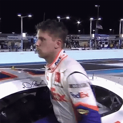 Man In FedEx Racing Suit Sitting In Race Car GIF