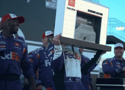 Man In FedEx Uniform Carrying Toyota Sign GIF