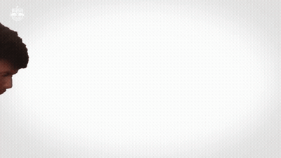 Man In FedEx Uniform Standing In Crowd GIF