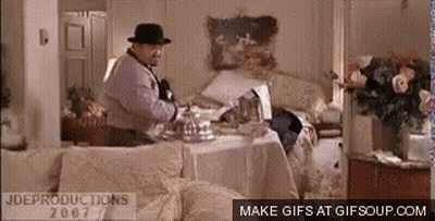 Man In Fedora At Messy Table GIF