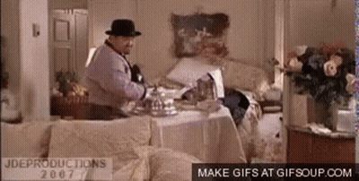 Man In Fedora At Messy Table GIF