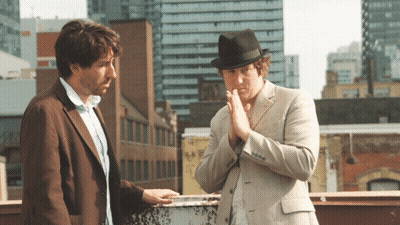 Man In Fedora Talking To Another Man GIF