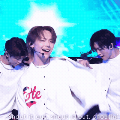 Man In Fete Shirt Dancing With Two Men GIF