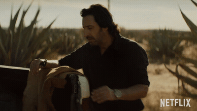 Man In Field With Netflix Logo GIF