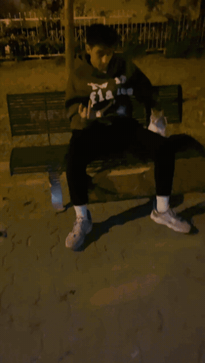 Man In Flakes Hoodie Sitting On Bench With Cat GIF