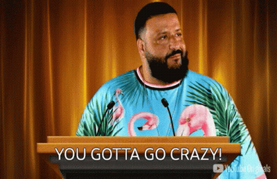 Man In Flamingo Shirt Behind Podium GIF