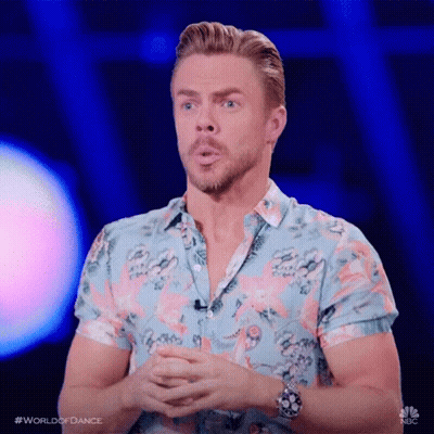 Man In Flamingo Shirt Folding Hands At Microphone GIF