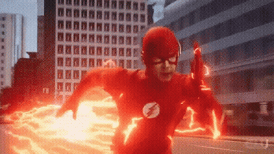 Man In Flash Costume Running Through City GIF