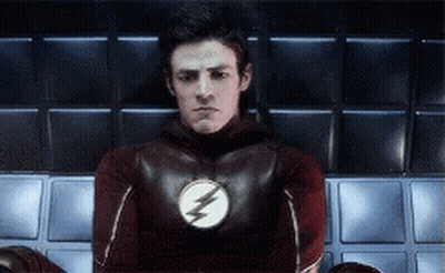 Man In Flash Costume Sitting GIF
